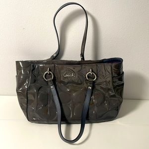 Gray patent leather Coach handbag.